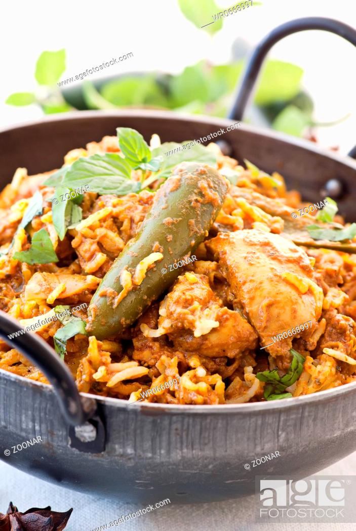 Stock Photo: Traditional Indian Biryani in a steampot as closeup.