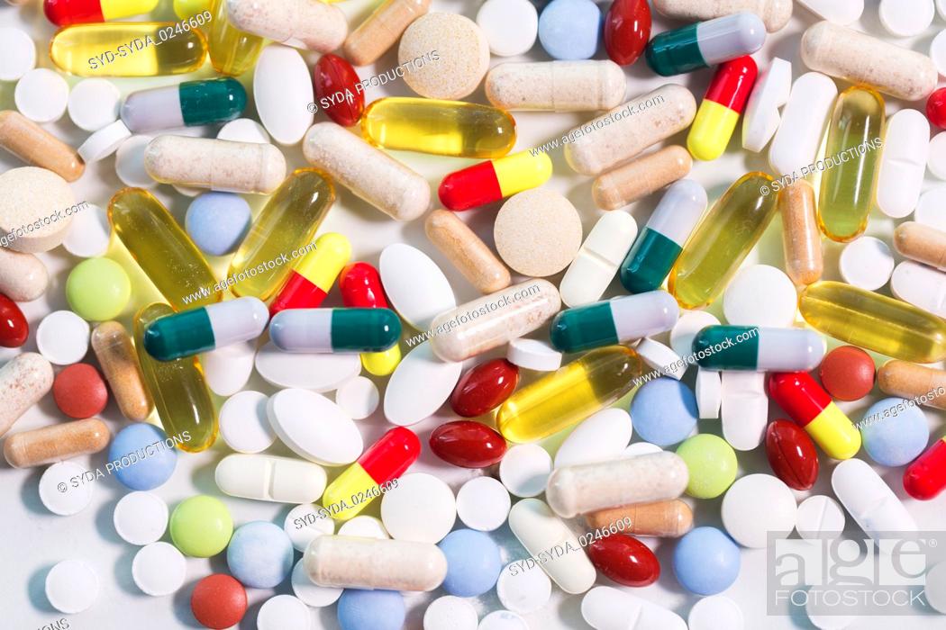 Stock Photo: different pills and capsules of drugs.