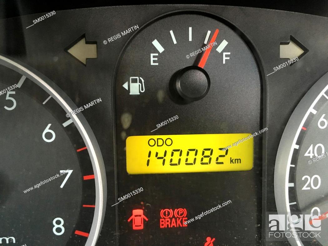 Stock Photo: Car odometer and fuel gauge.