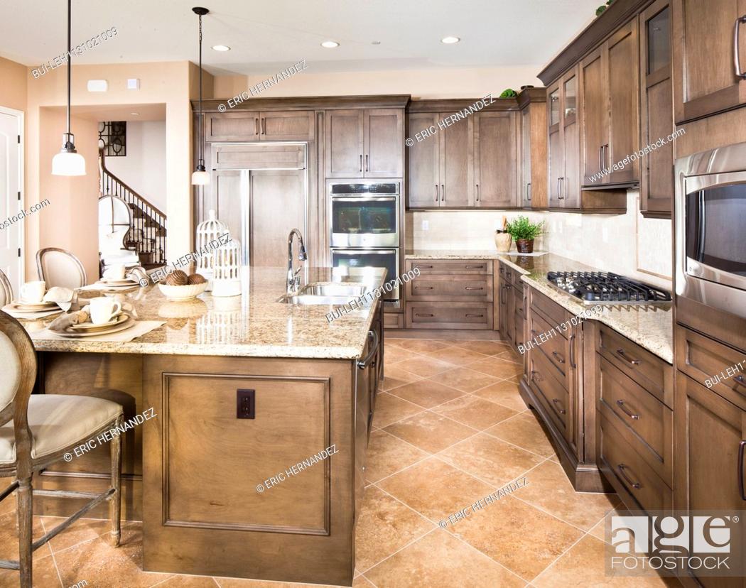 Kitchen With Brown Cabinets And Island At Home Irvine California