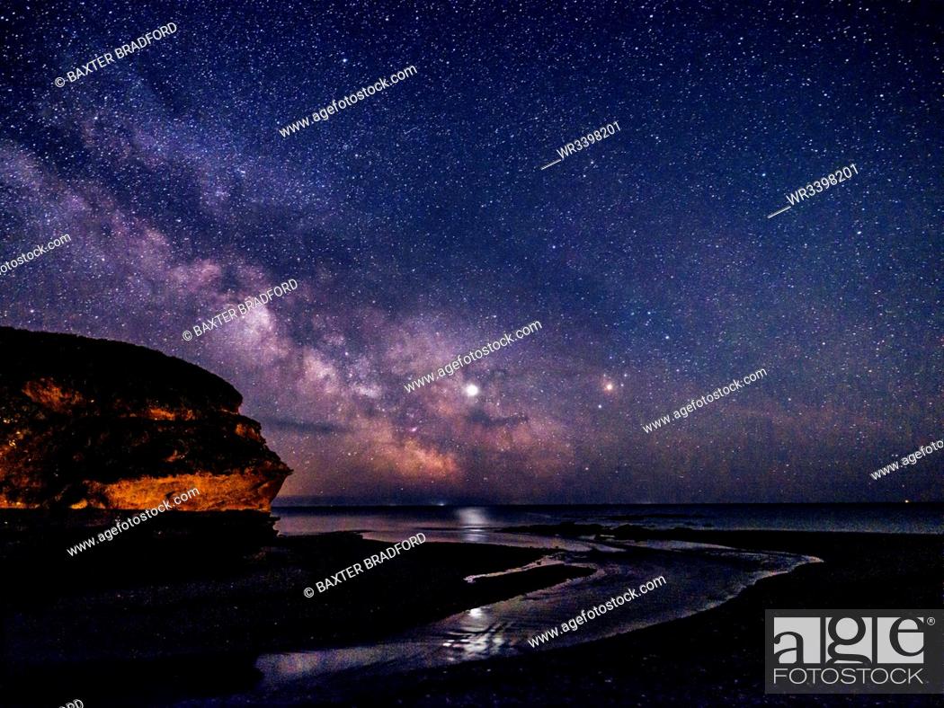 Stock Photo: Milky Way and Jupiter beyond Otter Head at Budleigh Salterton, Devon, England, United Kingdom, Europe.