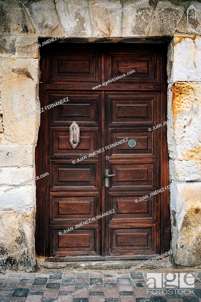 Stock Photo: Old Weathered Wooden Door of Historic Spanish Colonial Home.