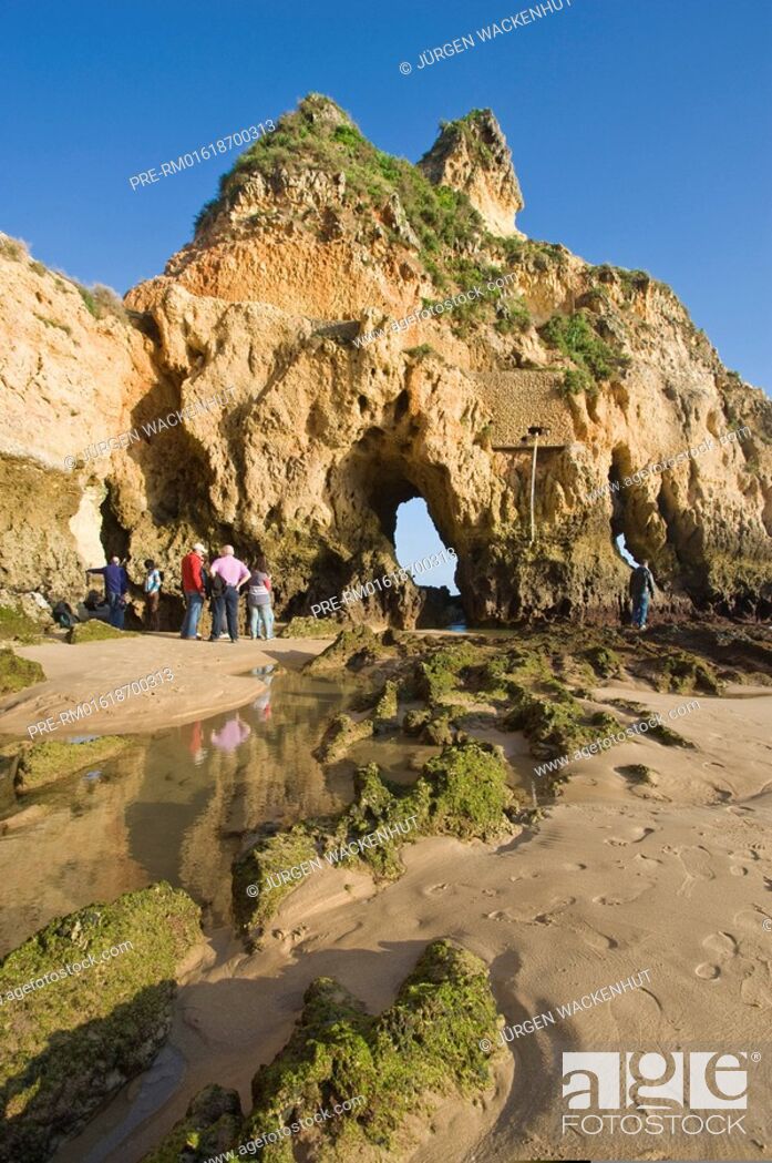 Stock Photo: Visitors at Praia dos Tres Irmaos near Alvor, Algarve, Portugal, Europe.