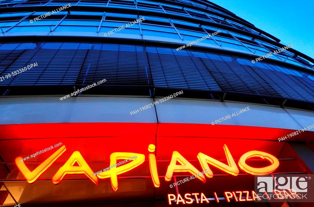 Stock Photo: 19 August 2019, Berlin: The entrance to a restaurant of the chain Vapiano. The Cologne-based company intends to continue its restructuring course.