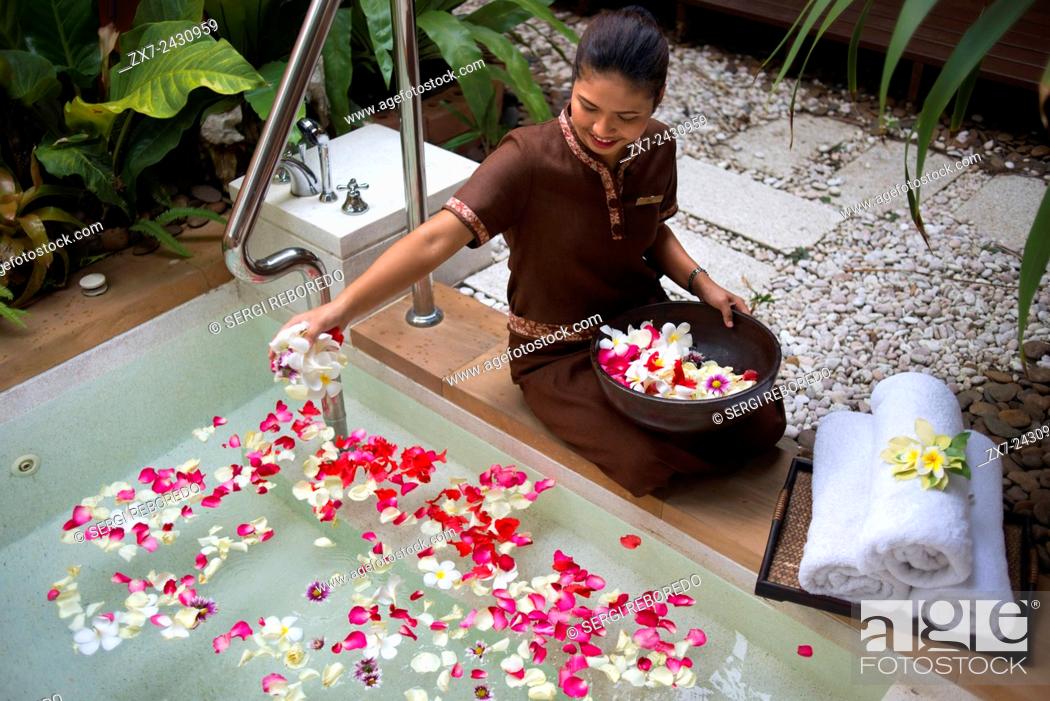 Stock Photo: Preparing the bath with flowers and bath salls in the Spa of Anantara Si Kao Resort & Spa, south of Krabi, Thailand. Located on the soft white sands of.