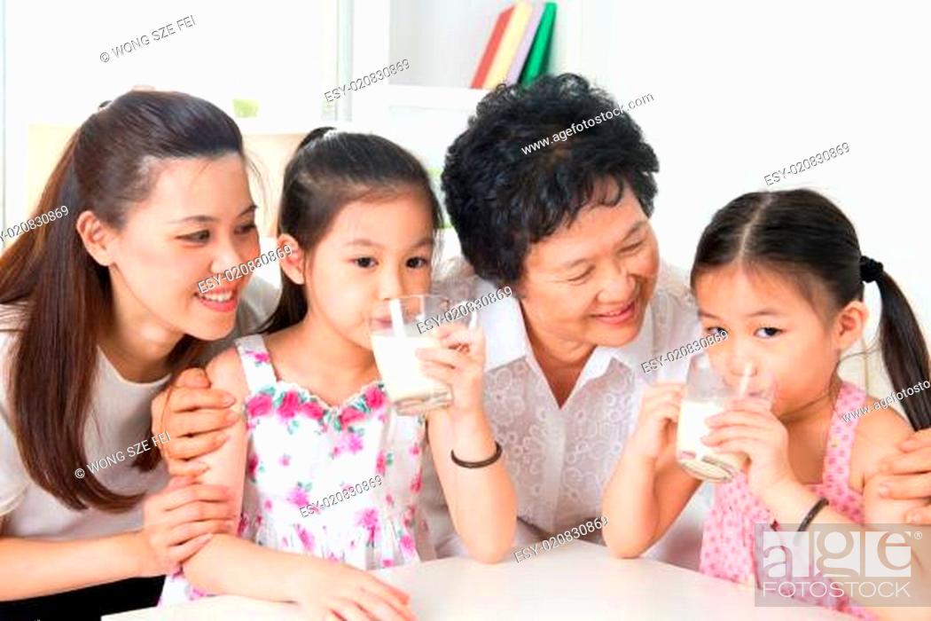 Stock Photo: Happy multi generations Asian family at home.