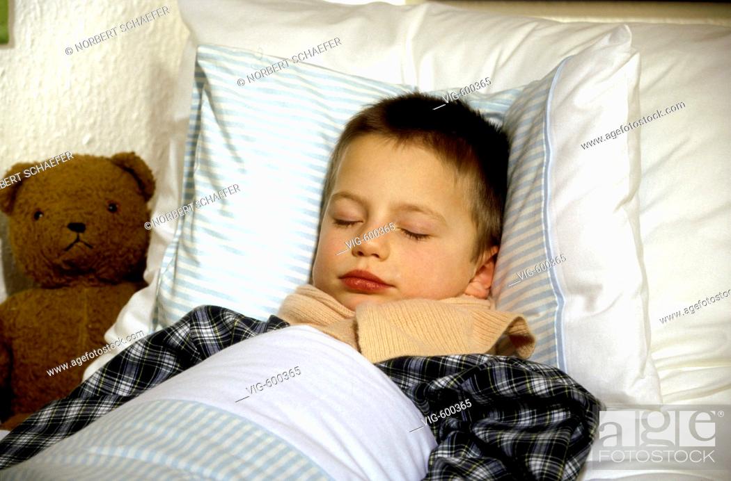 Stock Photo: Sick boy is lying in bed. - 12/12/2007.