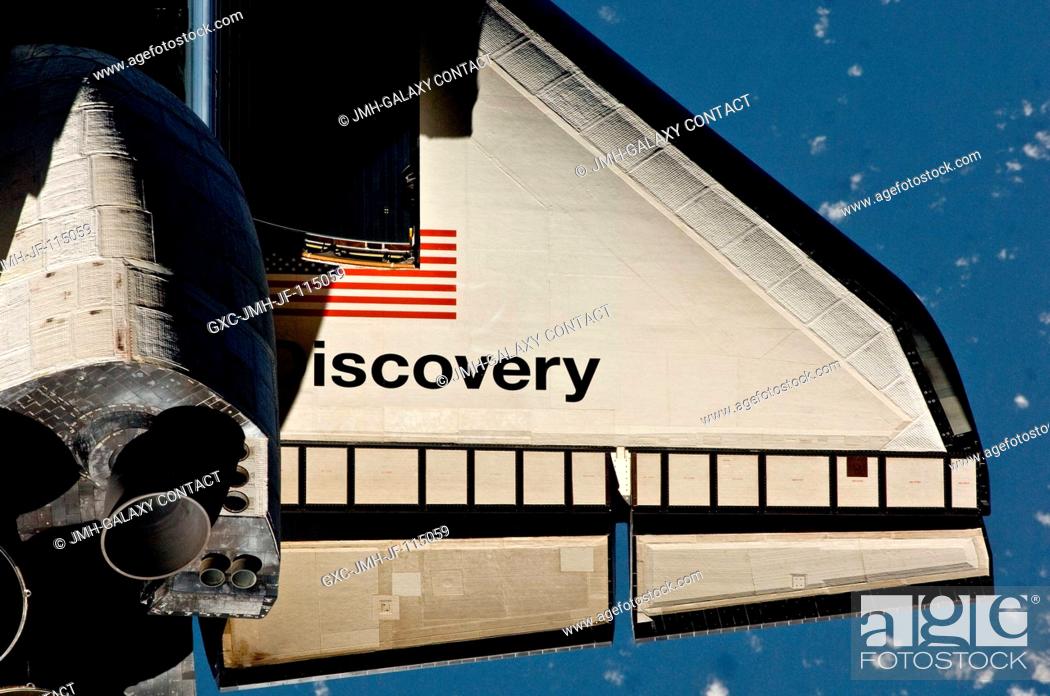 Stock Photo: This partial view of the starboard wing of the space shuttle Discovery was provided by an Expedition 26 crew member during a survey of the approaching STS-133.