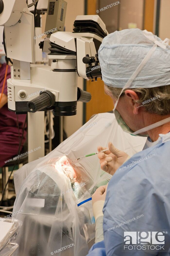 Stock Photo: Ophthalmologist performing cataract surgery.