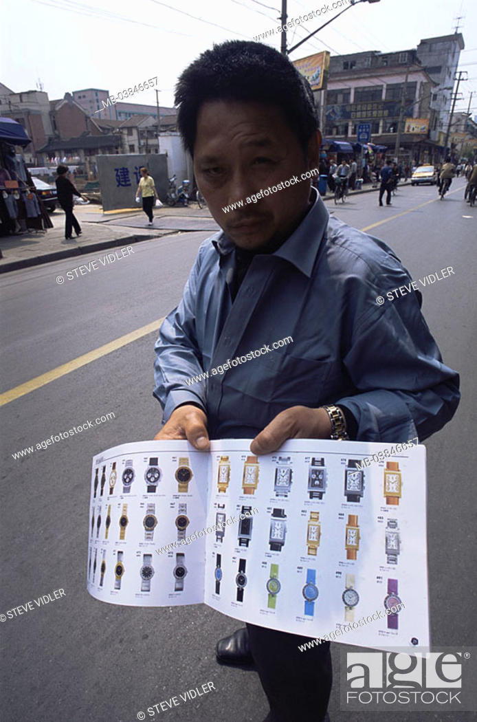 Stock Photo: China, Shanghai, models no release, Asia, strangely hawkers, Uhren-Katalog, salespersons, dealers, Asiate, gaze camera, man, middle age, Eastern Asia.
