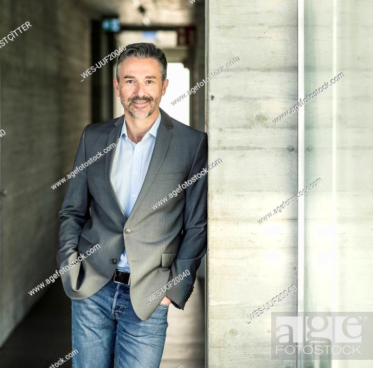 Stock Photo: Portrait of a confident mature businessman in office.