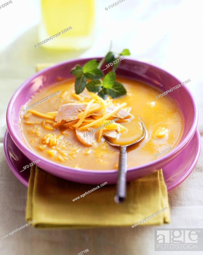 Stock Photo: Mango soup with chicken breast and fresh mint.