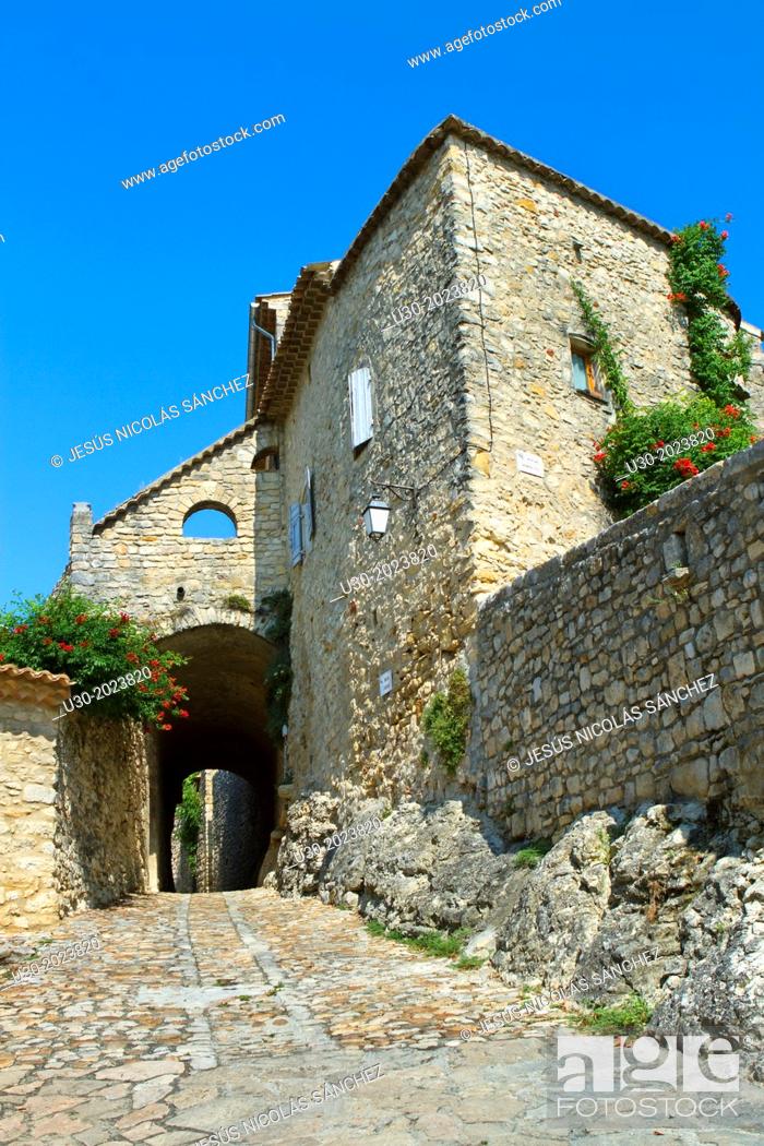 Stock Photo: Typical paved street in Roque-sur-Ceze, labelled The Most Beautiful Villages of France. Gard deparment, Languedoc-Roussillon region. France.