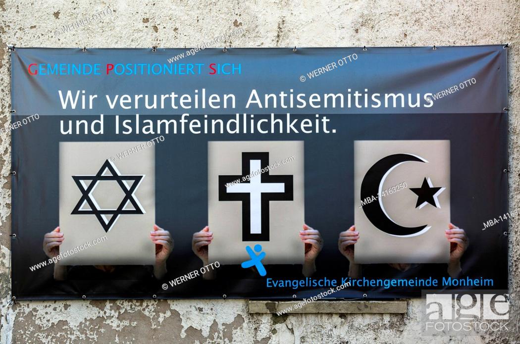 Stock Photo: germany, society, religion, christian church, the evangelical church community of monheim am rhein condemned anti-semitism and islamophobia on a banner.