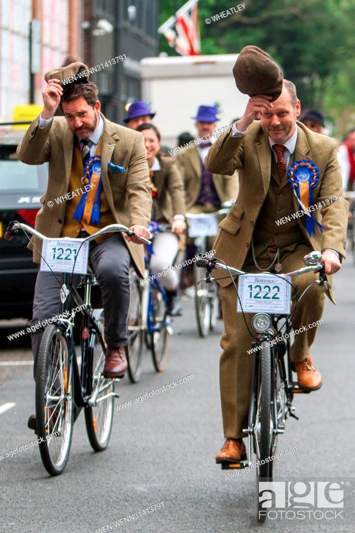 Stock Photo: Hundreds join the annual Tweed Run, a metropolitan bicycle ride with a bit of style. Taking to the streets in well-pressed best.