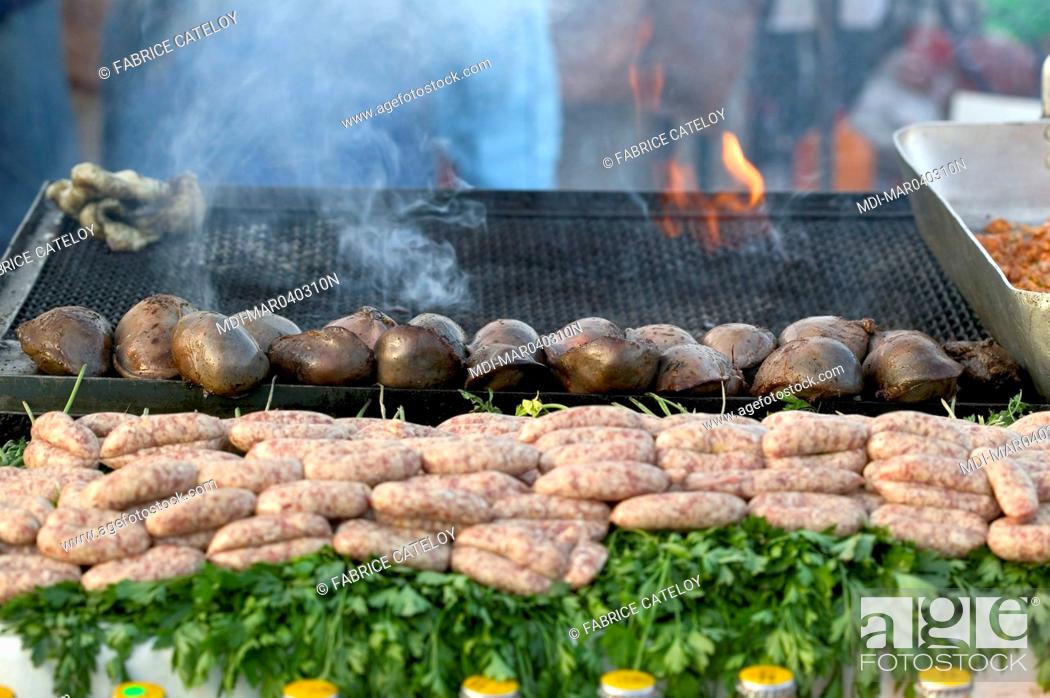 Stock Photo: Jemaa El Fna place - Stuffed spleen grilled on barbecue and sausage on a stand.