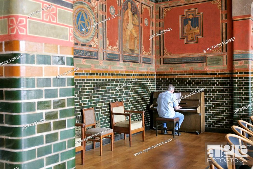Stock Photo: PIANO PLAYER, INSIDE THE FORTRESS BURCHT VAN BERLAGE, AMSTERDAM, NETHERLANDS.