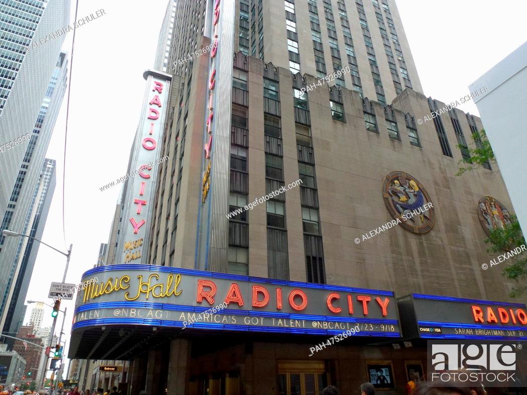 Stock Photo: (FILE) - An archive picture, dated 18 August 2014, shows a view of Radio City Music Hall (L) and a skyscraper on 6th Avenue in Manhattan, New York, USA.