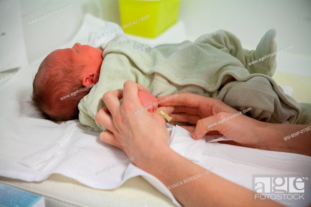 Stock Photo: Reportage on postpartum care in the maternity clinic in Chambéry, France. Newborn babies receive their first postnatal care.