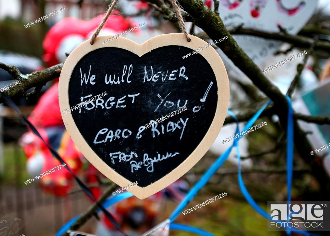 Stock Photo: The flowers and tributes have been moved from outside George Michael's Highgate home and placed in the communal garden across from it.