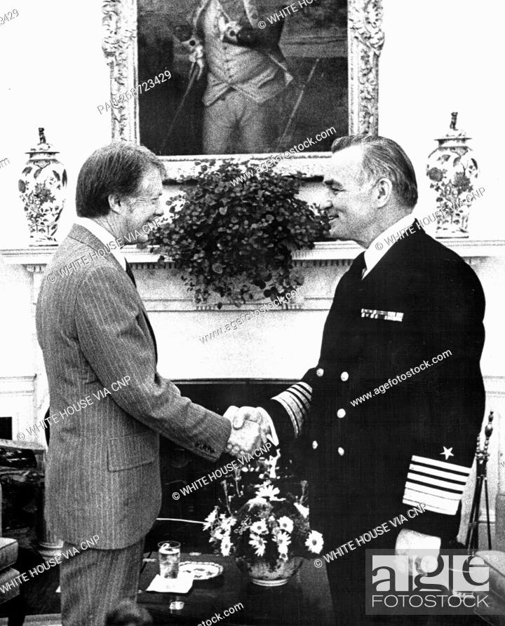Stock Photo: United States President Jimmy Carter, left, shakes hands with US Navy Admiral Stansfield Turner, his choice to be the director of the Central Intelligence.