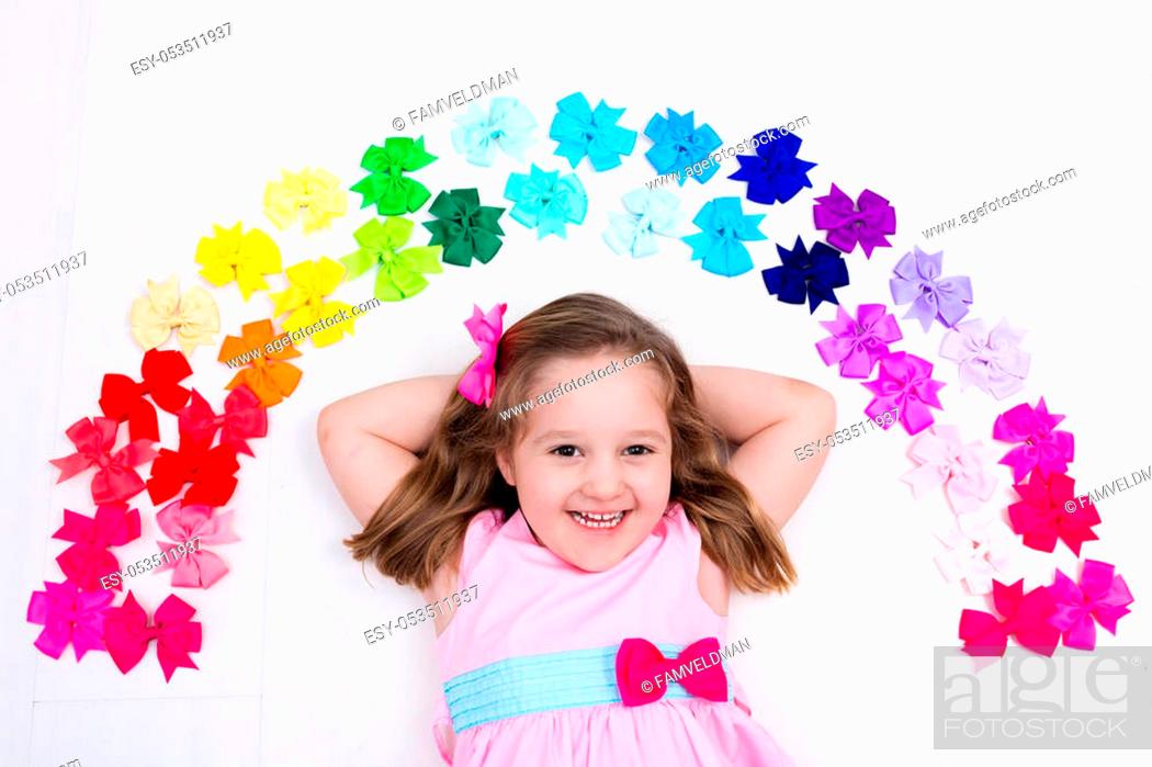Little girl in pink pastel dress choosing colorful hair accessories, Stock  Photo, Picture And Low Budget Royalty Free Image. Pic. ESY-053511937 |  agefotostock