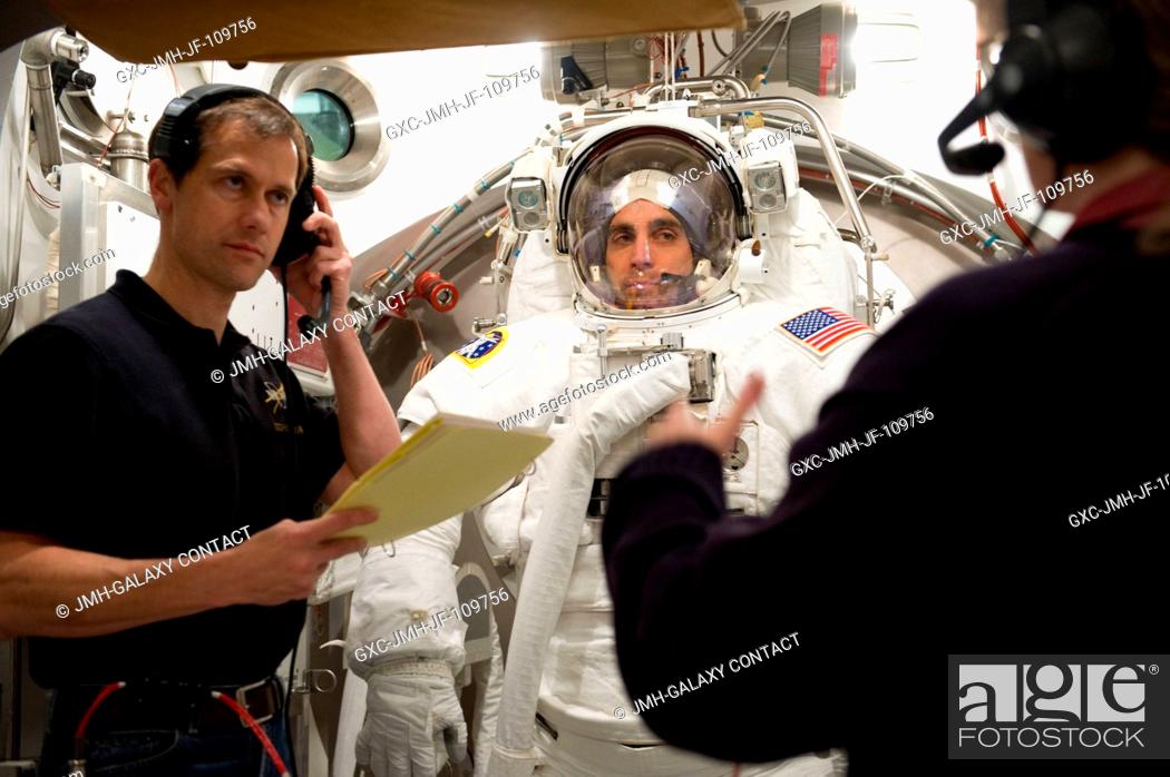 Stock Photo: Astronaut Christopher Cassidy, STS-127 mission specialist, participates in an Extravehicular Mobility Unit (EMU) spacesuit fit check in the Space Station.
