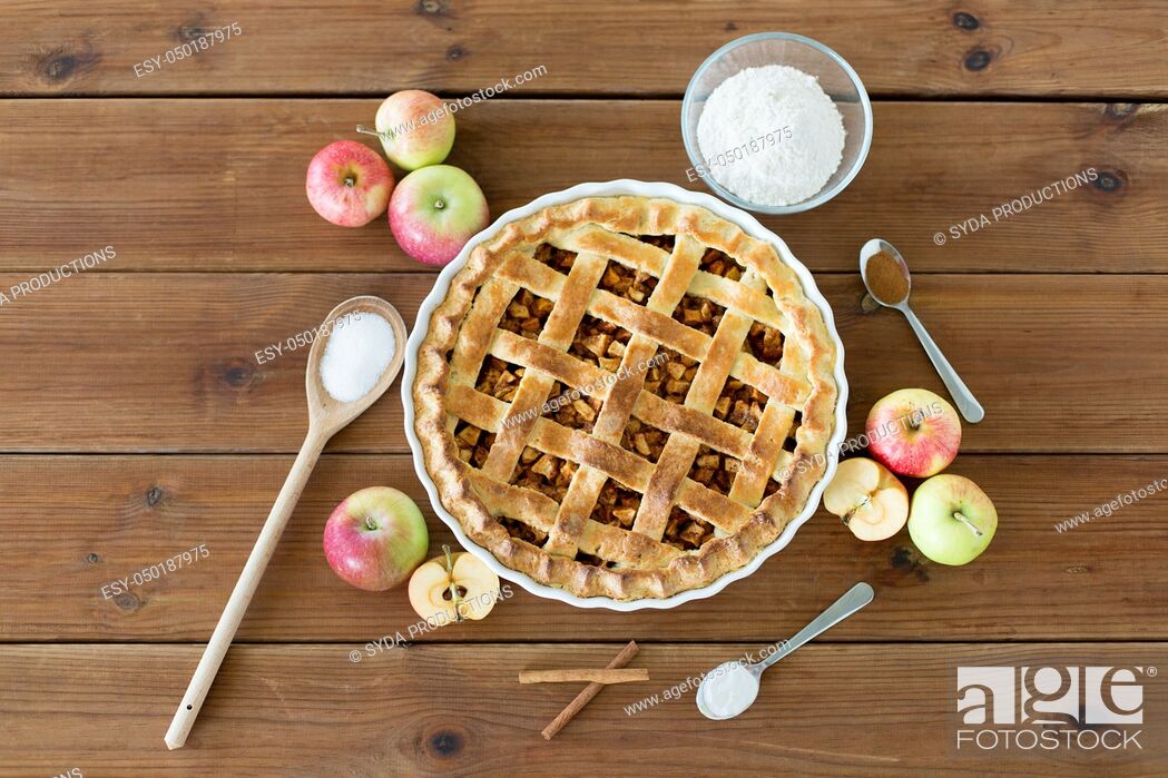 Stock Photo: close up of apple pie on wooden table.