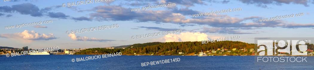Stock Photo: Oslo, Ostlandet / Norway - 2019/09/02: Panoramic view of Lindoya island on Oslofjord harbor with Lindoya Vest marina and summer cabin houses at shoreline in.