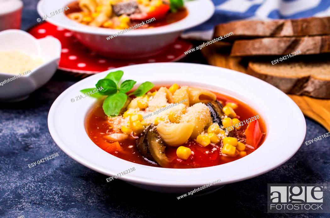 Stock Photo: Traditional Italian soup with pasta and vegetables in bowl on stone background. Selective focus.