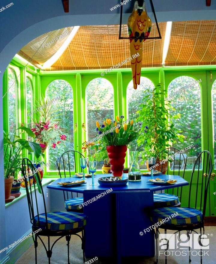 Blue Table And Metal Chairs In Lime Green And Pale Blue Conservatory Dining Room Extension Stock Photo Picture And Rights Managed Image Pic Foh U19793310 Agefotostock