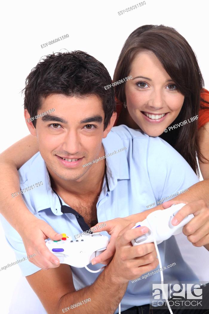 Photo de stock: Young couple playing video games together.