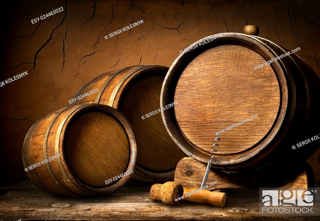 Stock Photo: Wooden barrels and corkscrew in clay cellar.