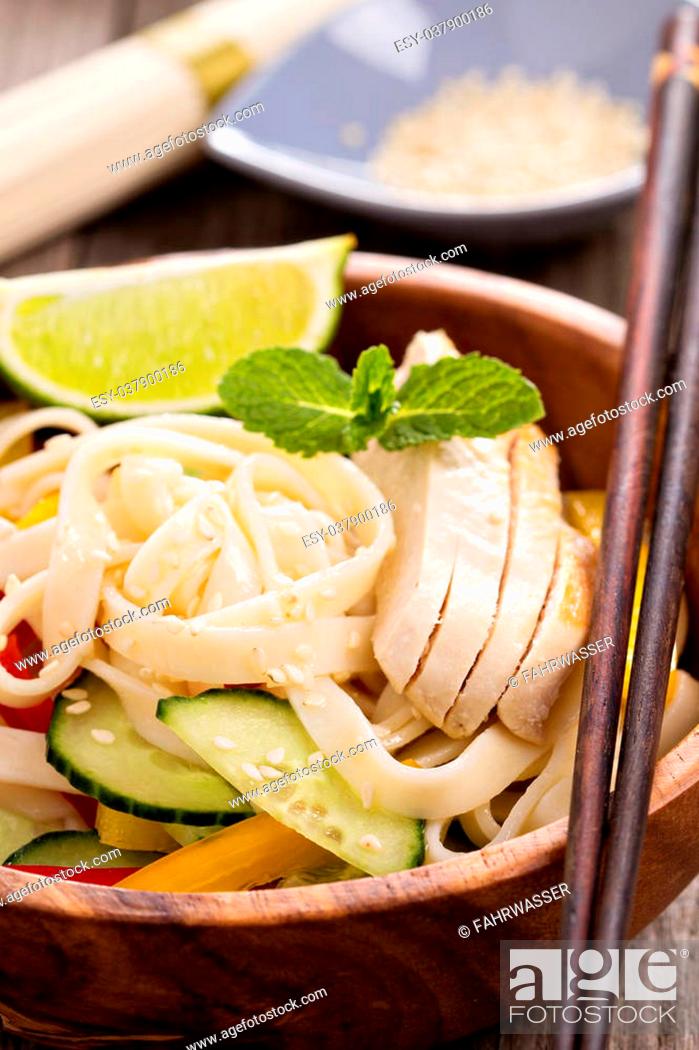 Stock Photo: Udon noodles with vegetables and chicken in a bowl.