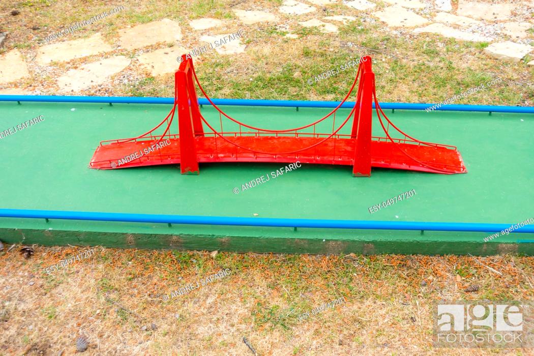 Mini golf course obstacles, red suspension bridge, Stock Photo, Picture And Low Budget Royalty Free Image. Pic. | agefotostock