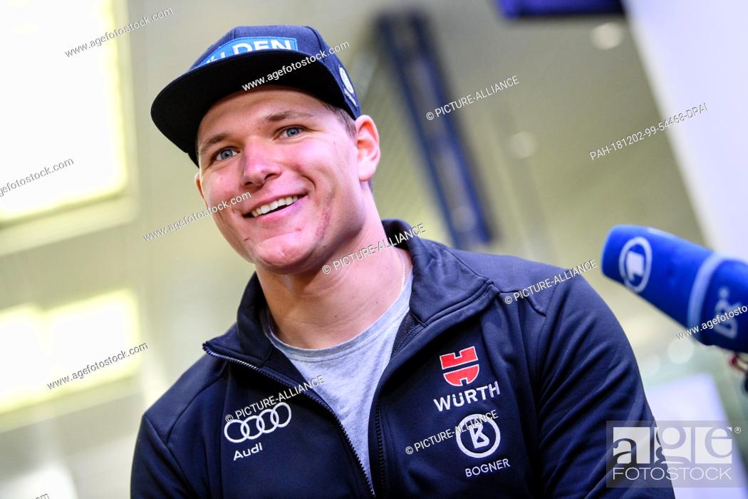 Stock Photo: 02 December 2018, Bavaria, München: Ski racer Thomas Dreßen makes a press statement on his arrival at the airport after his heavy fall on the descent to Beaver.