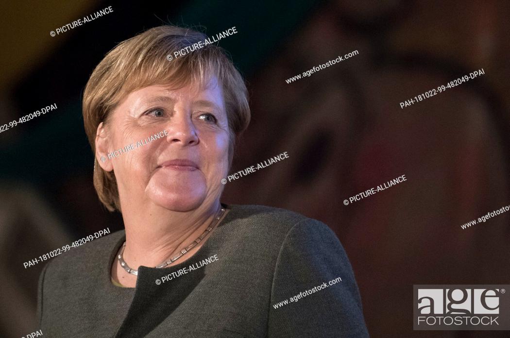 Stock Photo: 22 October 2018, Hessen, Ortenberg: Chancellor Angela Merkel (CDU) comes on stage in the marquee on the Cold Market. A new state parliament will be elected in.