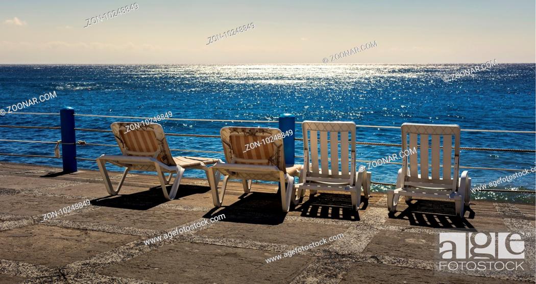 Stock Photo: Lying Down, Sea, Summer, Swimming, Three, Abandoned, Empty, Cable, Ocean, Spot, Madeira, Santa, Cruz, Gaffer, Open Air, Swimming Pool, Alte, Leer, Drei, Gesperrt, Spaced-Out, Freibad, Left Behind, Meer, Sonnenstuhl