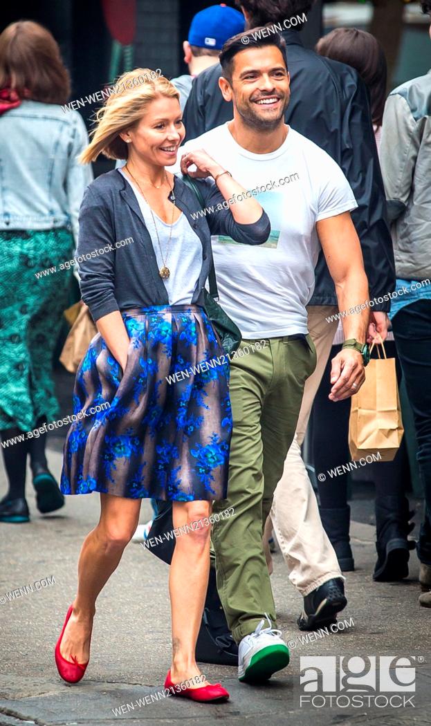 Stock Photo: Kelly Ripa and Mark Consuelos were all smiles in spite of wet weather as they were spotted strolling through SoHo Featuring: Kelly Ripa.