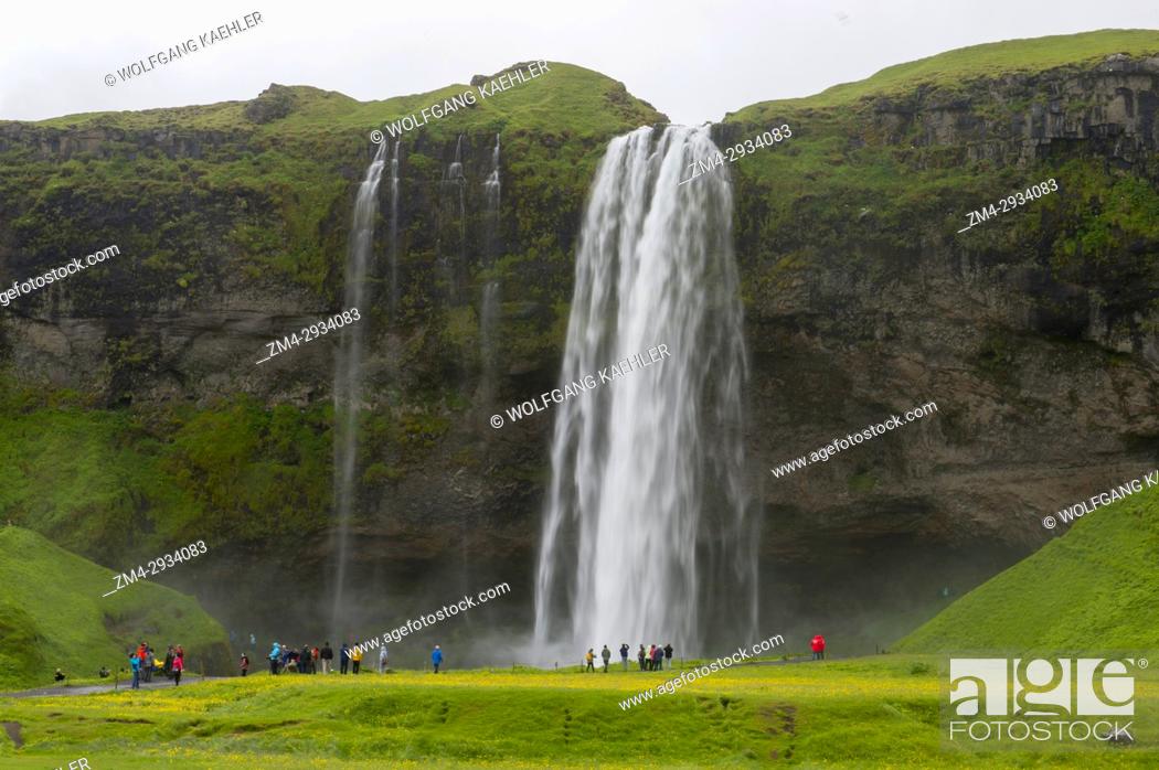 Stock Photo: The Seljalandsfoss is located in the South Region in Iceland and the waterfall drops 60 m (197 ft) and is part of the Seljalands River that has its origin in.
