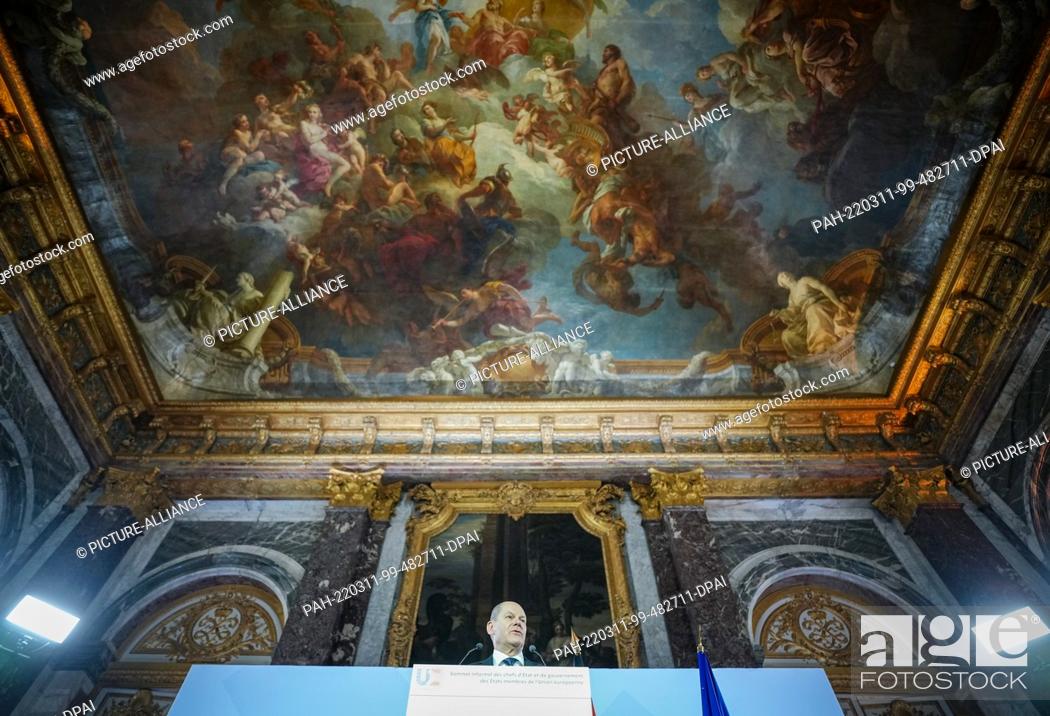 Stock Photo: 11 March 2022, France, Versailles: German Chancellor Olaf Scholz (SPD) gives a press conference at the Palace of Versailles after the meeting of European Union.
