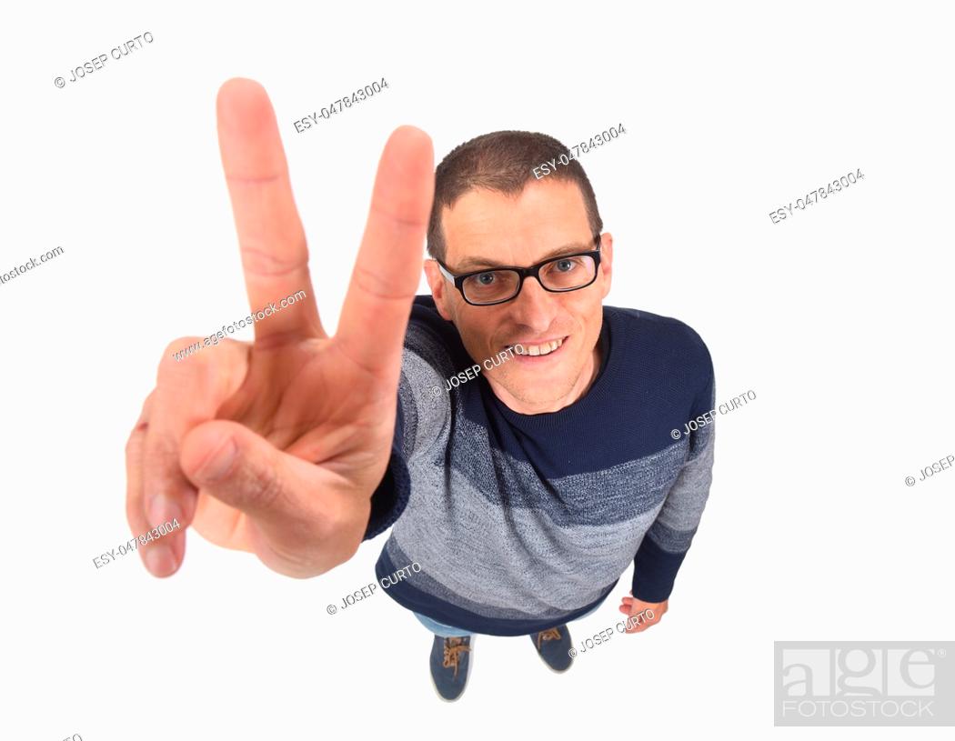 Imagen: man making the victory sign on a white background.