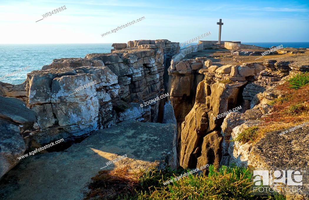 Stock Photo: Cross on the coast of Atlantic Ocean at Cruz dos Remedios, Peniche peninsula, Portugal.
