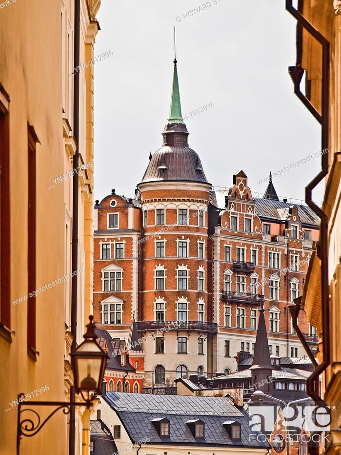 Stock Photo: Old buildings in Stockholm, Sweden, The red building known as Laurinska Huset also known as Mälarpalatset, is located at Bellmansgatan 4-6 in Södermalm.