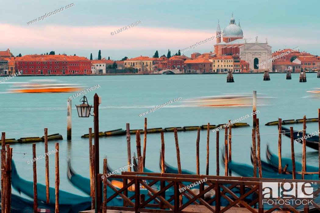 Stock Photo: Venice, Italy. Gondolas and beautiful lamppost in the foreground. San Giorgio di Maggiore church on background.