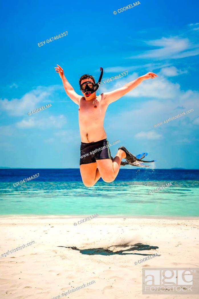 Funny man jumping in flippers and mask. Holiday vacation on a tropical  beach at Maldives Islands, Stock Photo, Picture And Low Budget Royalty Free  Image. Pic. ESY-047466357 | agefotostock