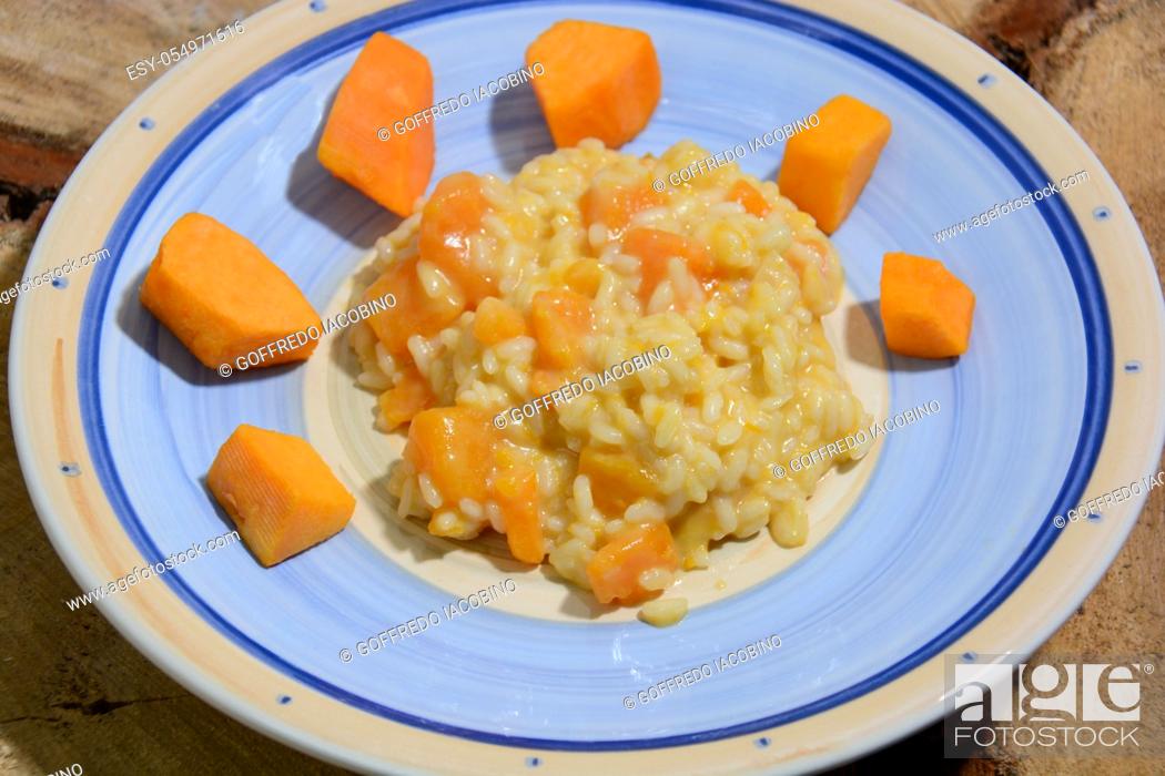Stock Photo: Italian food for Mediterranean healthy diet, risotto with pumpkin, spaghetti with clams.
