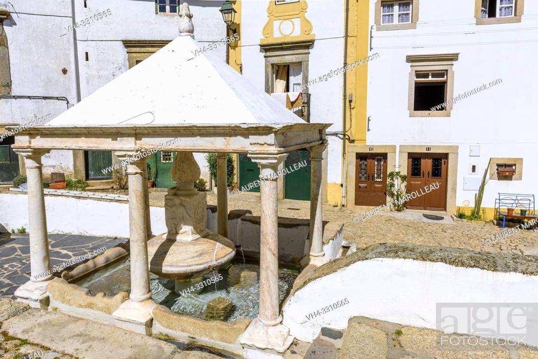 Stock Photo: The Town Fountain (Fonte da Vila), with Coat of arms of Castelo de Vide and figure of child, in the Jewish quarter of Castelo de Vide village.