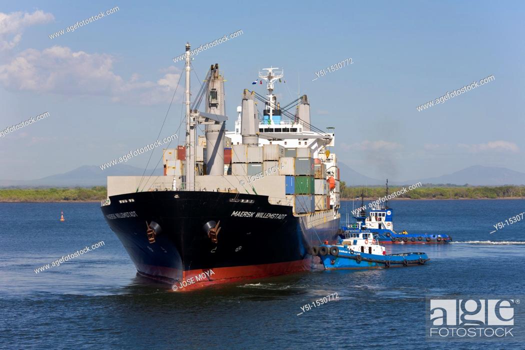 Stock Photo: Container ship with two tugs arriving at the Port of Corinto, Nicaragua.
