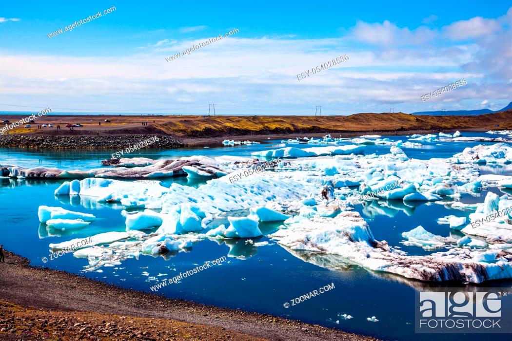 Stock Photo: White-blue ice is piled up in turquoise water of Jokulsarlon. The concept of extreme northern tourism.